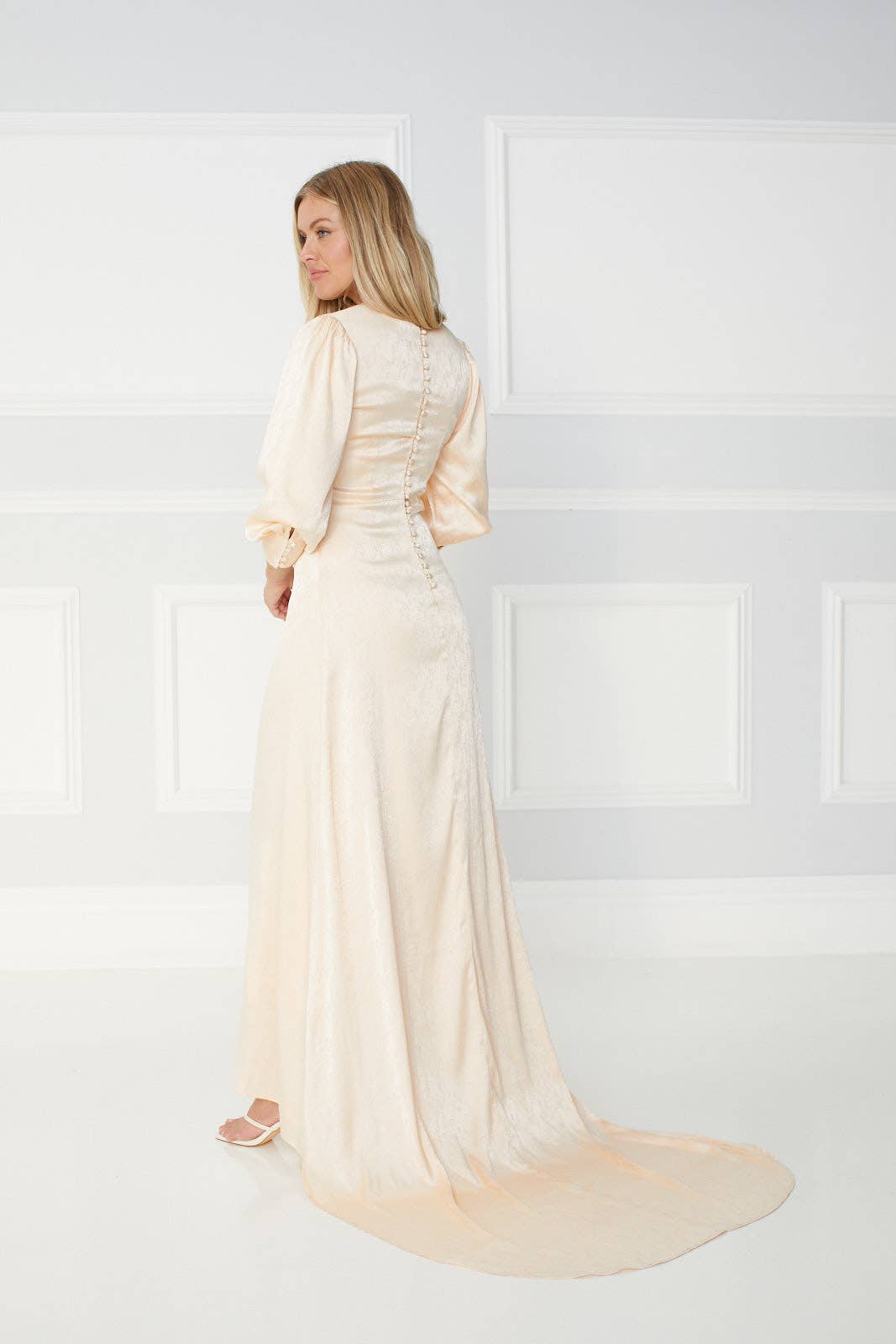 Tianna long gown in Pearl White with a Long Trail